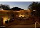 Night view of backyard patio with outdoor furniture and string lights at 202 W Twin Peaks Pkwy, San Tan Valley, AZ 85143