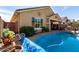 View of backyard patio, pool, and outdoor dining space at 202 W Twin Peaks Pkwy, San Tan Valley, AZ 85143