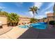 Backyard pool and spa surrounded by desert landscaping and a privacy fence at 202 W Twin Peaks Pkwy, San Tan Valley, AZ 85143