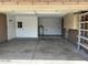 Spacious garage with concrete flooring and built-in shelving for organized storage at 2110 E Laguna Dr, Tempe, AZ 85282