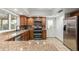 Kitchen featuring stainless steel appliances, granite countertops, and wood cabinetry at 2110 E Laguna Dr, Tempe, AZ 85282