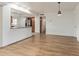 Living room with hardwood floors adjacent to a breakfast bar and kitchen at 2110 E Laguna Dr, Tempe, AZ 85282