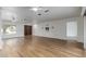 Spacious living room with hardwood floors, white walls, and natural light at 2110 E Laguna Dr, Tempe, AZ 85282