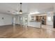 Open concept living room with hardwood floors, white walls, and sliding glass door at 2110 E Laguna Dr, Tempe, AZ 85282