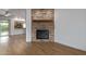 Beautiful stone fireplace with mantel in a spacious living room and updated flooring at 2110 E Laguna Dr, Tempe, AZ 85282