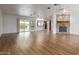 Spacious living room with wood-look flooring, a modern fireplace, and an open floor plan at 2110 E Laguna Dr, Tempe, AZ 85282