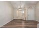 Dining room with wood floors, arched window, and pendant lighting at 2149 S Olivewood --, Mesa, AZ 85209