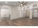 Spacious living room featuring wood floors, columns, and high ceilings at 2149 S Olivewood --, Mesa, AZ 85209