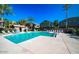 A community pool surrounded by lounge chairs and landscaping at 2150 W Alameda Rd # 1119, Phoenix, AZ 85085