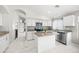 Modern kitchen featuring an island, granite counters, stainless steel appliances at 21867 N Kirkland Dr, Maricopa, AZ 85138