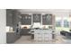 Modern kitchen features gray cabinets, a central island with seating, and stainless steel appliances at 2401 W Los Arboles Pl, Chandler, AZ 85224