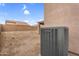 Backyard with a wall and an air conditioning unit, offering ample space at 24848 W Kowalsky Ln, Buckeye, AZ 85326