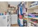 Organized walk-in closet with shelving, hanging rods, and storage bins at 24848 W Kowalsky Ln, Buckeye, AZ 85326