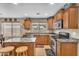 Well-lit kitchen featuring an island, stainless steel appliances, and ample cabinet space at 24848 W Kowalsky Ln, Buckeye, AZ 85326