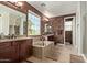 Luxurious bathroom features a soaking tub, double vanity, and elegant fixtures at 2830 E Janelle Way, Gilbert, AZ 85298