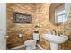 Elegant half-bathroom with decorative wallpaper and pedestal sink at 2830 E Janelle Way, Gilbert, AZ 85298