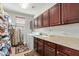 Functional laundry room with ample cabinet storage, sink, and washer-dryer hookups at 2830 E Janelle Way, Gilbert, AZ 85298