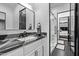 Bathroom featuring a granite countertop and a shower with black hardware at 29501 N 76Th St, Scottsdale, AZ 85266