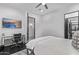 Bedroom showcasing a desk, a ceiling fan, and an attached room at 29501 N 76Th St, Scottsdale, AZ 85266