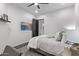 Relaxing bedroom boasts a TV, a comfortable bed, and a dark gray accent wall at 29501 N 76Th St, Scottsdale, AZ 85266