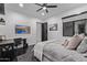 Modern bedroom featuring sleek black tile floors, a desk, and a serene ambiance at 29501 N 76Th St, Scottsdale, AZ 85266