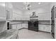 Well-equipped laundry room featuring modern washer, dryer, and ample storage space at 29501 N 76Th St, Scottsdale, AZ 85266