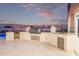 Well-equipped outdoor kitchen area with a built-in grill, sink, and ample counter space at 29501 N 76Th St, Scottsdale, AZ 85266