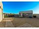 Practical backyard shed with ample storage space complemented by a paved area at 29501 N 76Th St, Scottsdale, AZ 85266