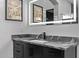 Modern bathroom vanity with an illuminated mirror at 29501 N 76Th St, Scottsdale, AZ 85266