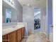 Bathroom view with double sink vanity and walk-in closet and shower at 3102 W T Ryan Ln, Phoenix, AZ 85041