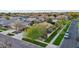 Aerial view features a home with a tidy front yard, mature trees and street corner location at 3482 E Cotton Ln, Gilbert, AZ 85234