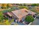 Aerial view shows backyard pergola, air conditioners, storage shed, and citrus trees at 3482 E Cotton Ln, Gilbert, AZ 85234