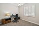 Bedroom featuring neutral carpeting, a ceiling fan, and a window with shutters at 3482 E Cotton Ln, Gilbert, AZ 85234