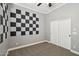 Bedroom featuring carpet, a ceiling fan, plantation shutters and closet at 3482 E Cotton Ln, Gilbert, AZ 85234