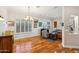 A formal dining room with hardwood floors and many paintings on the wall at 3482 E Cotton Ln, Gilbert, AZ 85234