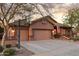 Inviting home featuring a three-car garage, a basketball hoop, and landscaped front yard at 3482 E Cotton Ln, Gilbert, AZ 85234