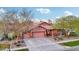 Charming home featuring a three-car garage, basketball hoop and covered porch at 3482 E Cotton Ln, Gilbert, AZ 85234