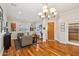 Bright living room features hardwood floors, neutral paint, and elegant lighting fixture at 3482 E Cotton Ln, Gilbert, AZ 85234