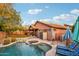 The backyard features a pool, a hot tub, and plenty of space for outdoor relaxation and entertainment at 3482 E Cotton Ln, Gilbert, AZ 85234