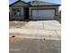 New construction home showing the front of the house with a concrete driveway leading to a two car garage at 3983 E San Jose St, San Tan Valley, AZ 85143