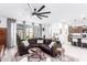 Cozy living room featuring a large sectional sofa and stylish accents at 40160 W Hensley Way, Maricopa, AZ 85138