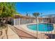 Private backyard pool view shows serene privacy with well kept yard and fencing at 4111 W Hayward Ave, Phoenix, AZ 85051