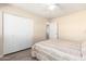 Cozy bedroom featuring a ceiling fan, closet, and neutral tones at 4111 W Hayward Ave, Phoenix, AZ 85051