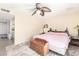 A calming bedroom with a ceiling fan and soft, neutral tones and decor at 4111 W Hayward Ave, Phoenix, AZ 85051