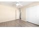 Bedroom with modern grey flooring and large closet for storage at 4111 W Hayward Ave, Phoenix, AZ 85051