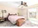 Bedroom with ceiling fan, sliding glass door, and area rug at 4111 W Hayward Ave, Phoenix, AZ 85051