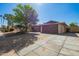 Charming house featuring a spacious driveway, well-kept landscaping, and an attached two-car garage at 4111 W Hayward Ave, Phoenix, AZ 85051