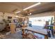 Garage with workbench area, and ample lighting at 4111 W Hayward Ave, Phoenix, AZ 85051