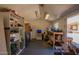 Large garage with shelving and work area; ideal for storage and home projects at 4111 W Hayward Ave, Phoenix, AZ 85051