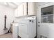 Convenient laundry room with washer, dryer, and storage cabinets at 4111 W Hayward Ave, Phoenix, AZ 85051